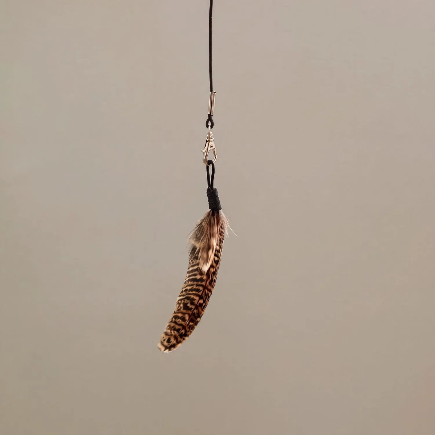 The Wren hanging on its Dyneema cord and clasp