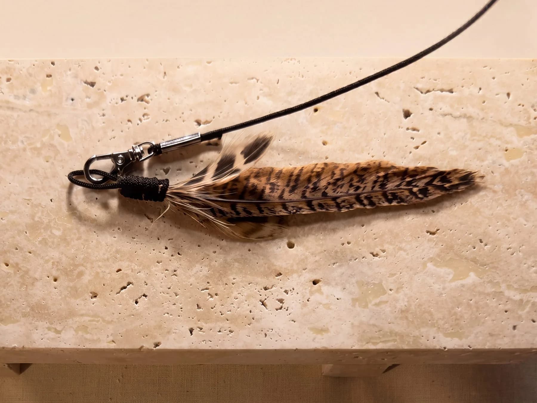 The Wren laid on stone - clasp, cord wrap and barring